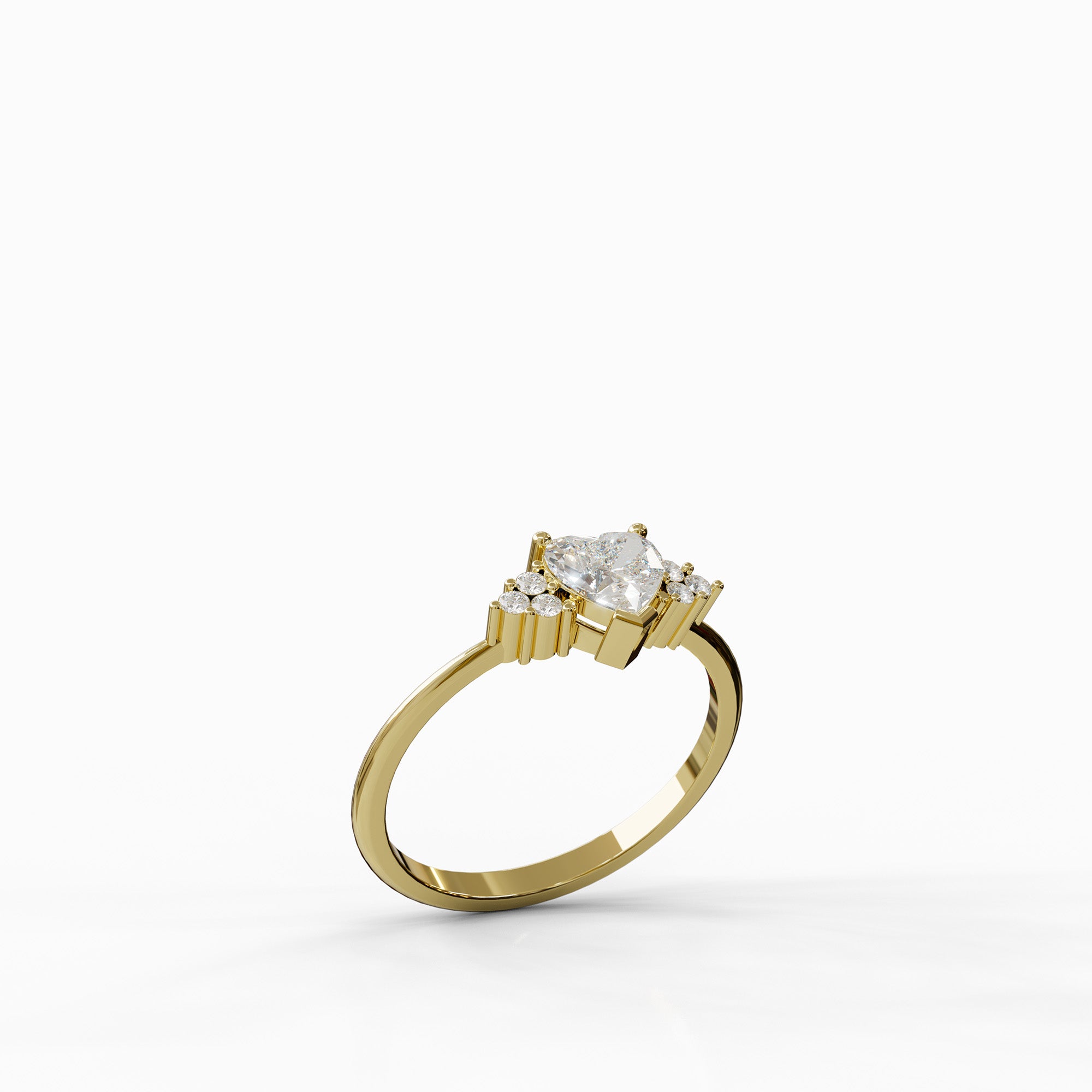 טבעת Alma מזהב 14 קראט בשיבוץ יהלום טבעי בצורת לב (0.7 קראט) ו-6 יהלומים צדיים